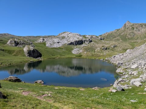 Lac de Casterau with reflection of surrounding mountains, Pyrenees, France