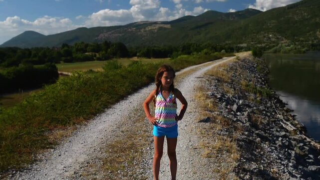 Little beautiful girl about Ricice lake, Croatia