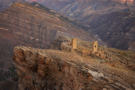 Ruins and towers of the aul ghost Goor in Dagestan in the evening light
