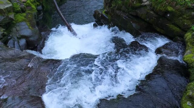 Aerial view from a drone of the waterfall landscape around the village of Vega de Pas. Pasiegos Valleys region, Cantabria, Spain, Europe