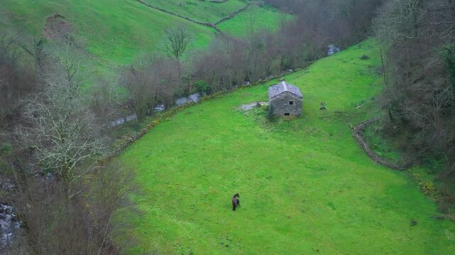 Aerial view from a drone of the winter landscape around the village of Vega de Pas. Pasiegos Valleys region, Cantabria, Spain, Europe
