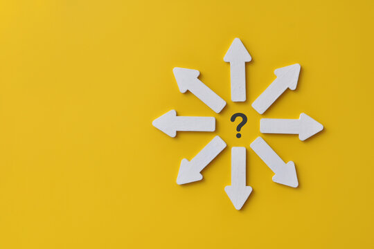 Business decision concept with multiple direction arrows and question mark