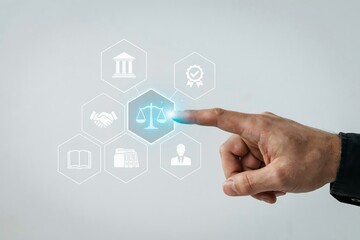 Obraz premium Person touching a digital interface with legal icons representing justice and law services.