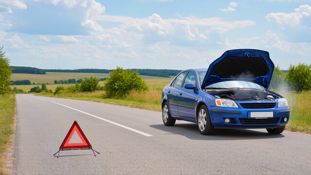 Broken down car on the road, Emergency warning triangle on asphalt, Vehicle malfunction with open hood, Roadside assistance and towing service, Overheated car engine on country road