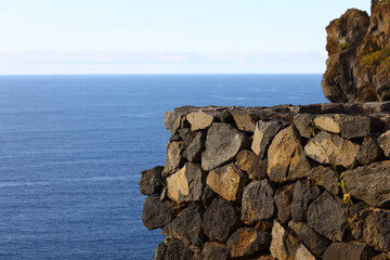 Volcanic stone wall overlooking the Atlantic Ocean in Tenerife © Gabriela