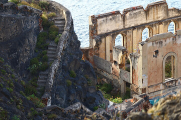 Abandoned coastal ruins built on volcanic cliffs above the Atlantic Ocean © Gabriela