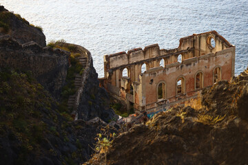 Abandoned coastal ruins on volcanic cliffs above the Atlantic Ocean © Gabriela