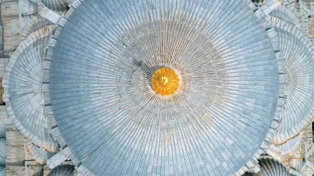 Suleymaniye Mosque dome close up aerial drone shot in Istanbul. Detailed view of majestic Ottoman architecture historic landmark and minarets.