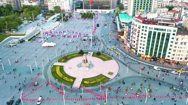 Istanbul Taksim Square and mosque aerial drone shot. Panoramic view of iconic central plaza, modern Islamic architecture and Beyoglu cityscape.