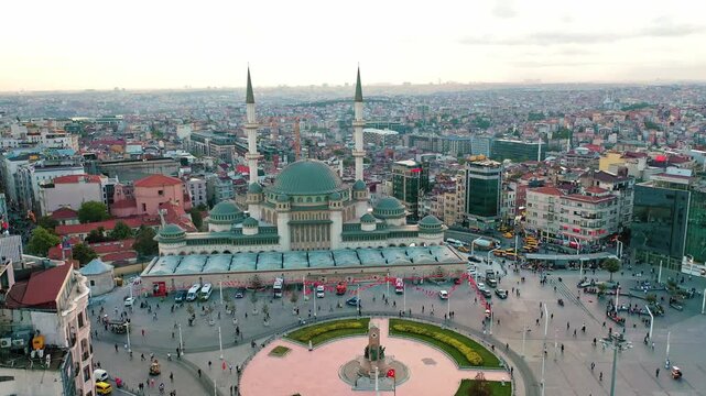 Istanbul Taksim Square and mosque aerial drone shot. Panoramic view of iconic central plaza, modern Islamic architecture and Beyoglu cityscape.
