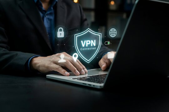 Businessman using laptop with virtual vpn shield icon for secure internet connection safety