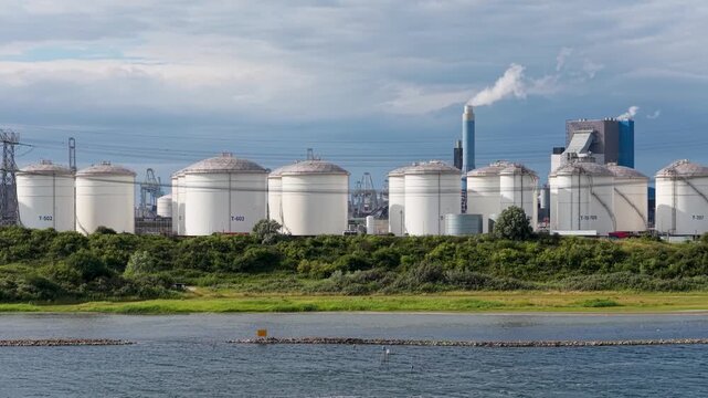 Aerial drone view of industrial oil and fuel storage tanks. Large containers and facility infrastructure for petroleum products and energy resource reserve.