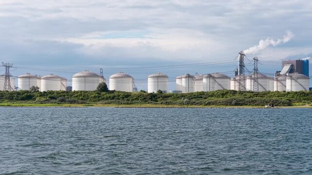Aerial drone view of industrial oil and fuel storage tanks. Large containers and facility infrastructure for petroleum products and energy resource reserve.