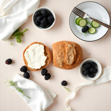 Overhead flat lay of multigrain bread with goat cheese and blackberries