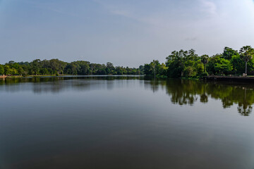 Fototapeta premium Calm Tropical Lake Surrounded by Lush Forest