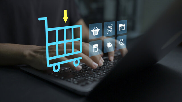 Online shopping cart concept. Person using laptop with ecommerce and shopping cart icons, digital purchasing, secure online payments and retail technology.