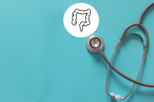 close up stethoscope with symbol of intestine for health and lifestyle concept