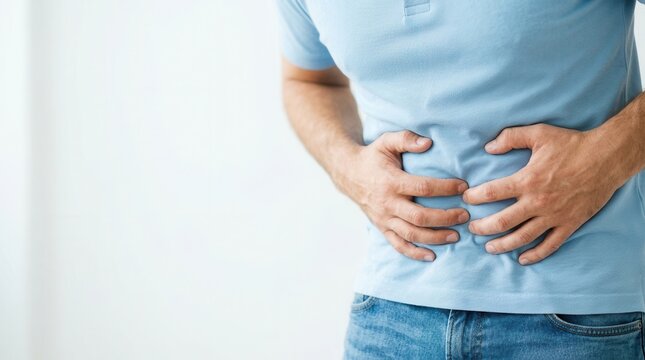 A man suffering from a painful stomach ache and abdominal discomfort.