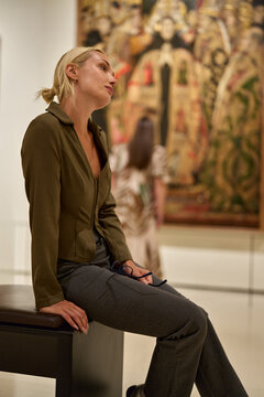 Caucasian woman looking at exhibition