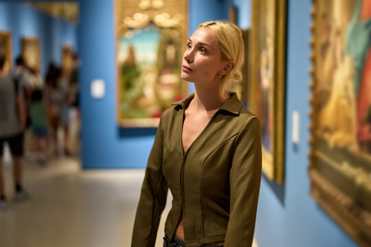 Caucasian woman looking at exhibition