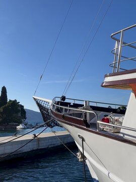 Elegant vessel lying at the marina . The sea rocks the boat on a calm sunny day. Marina on the island of Hvar. Relaxed travel and vacation concept.FullHD footage