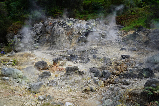 Bandung, Indonesia - July 4, 2026: Steam rises from the geothermal vents at Rengganis Crater in Ciwidey, Bandung, West Java, Indonesia. The volcanic tourist attraction is known for its natural hot spr