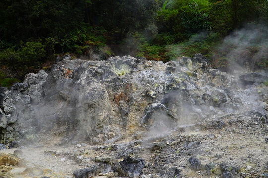 Bandung, Indonesia - July 4, 2026: Steam rises from the geothermal vents at Rengganis Crater in Ciwidey, Bandung, West Java, Indonesia. The volcanic tourist attraction is known for its natural hot spr