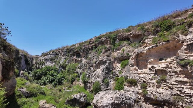 Wied il Mielah, Gharb, Gozo - Valley near limestone natural arch on the north-western coast of the island of Gozo in Malta. High quality 4k footage