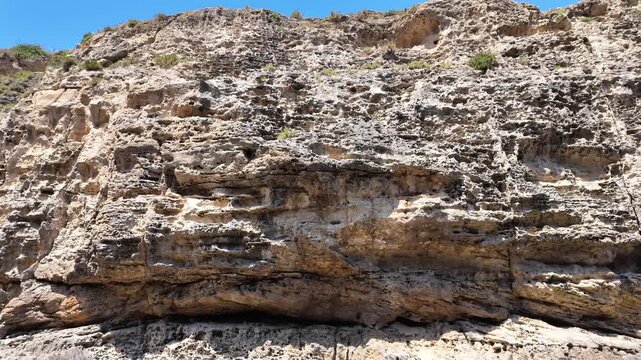 Wied il Mielah, Gharb, Gozo - Valley near limestone natural arch on the north-western coast of the island of Gozo in Malta. High quality 4k footage