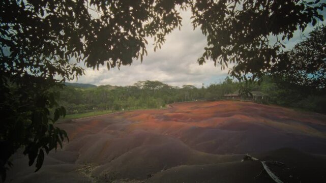 Colorful hills under misty sky, Gentle lighting highlights colorful rolling hills and tranquil surroundings