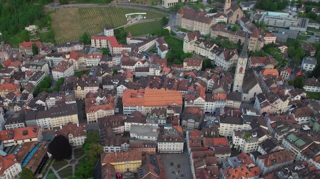 Aerial panoramic view above the old town around the city Chur in Switzerland on a sunny summer afternoon. 