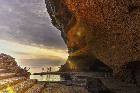 HDR, Spiaggia Sataria, evening light, sunset, grotto by the sea, stairs, people, Pantelleria, Pelagic Islands, Sicily, Italy