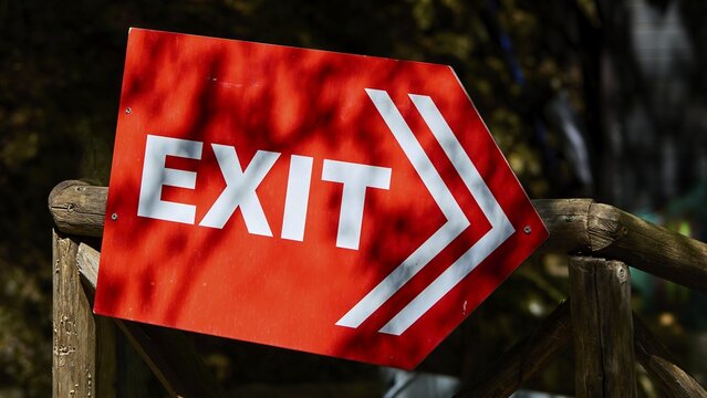Red exit sign with arrow indicating direction, mounted on wood, Butterfly Valley, Butterfly Valley, Rhodes, Dodecanese, Greek Islands, Greece