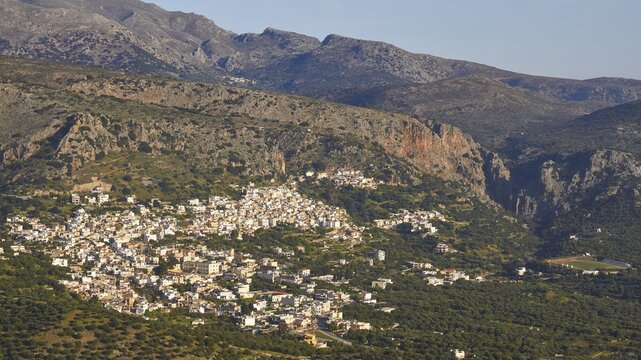 Spring in Crete, mountain village Kritsa, gorge, mountains, hillside village, light blue sky, East Crete, island Crete, Greece