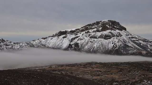 Caldera, snow-covered mountain range with fog and cloudy sky, Teide, Parque Nacional del Teide, Teide National Park, volcano, volcanism, UNESCO World Heritage Site, Tenerife, Canary Islands, Spain