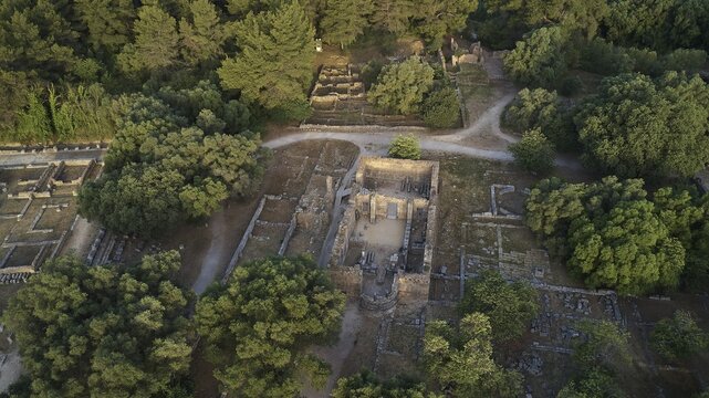 Workshop of Phidias and Early Christian Bailica, morning light, aerial view of ancient ruins in the midst of dense forest surrounded by lush vegetation, drone shot, archaeological site, Ancient Olympia, Olympia, Peloponnese, Greece