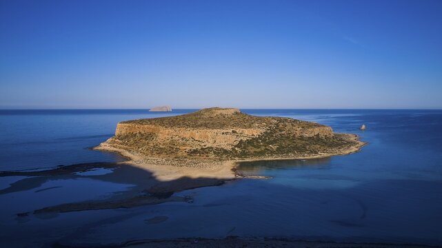 Drone image, aerial view of a large island with a steep rocky coast, surrounded by clear blue sea, Gramvoussa, Gramvoussa peninsula, Pirate Bay, Balos, lagoon, north-west Crete, Crete, Greek Islands, Greece