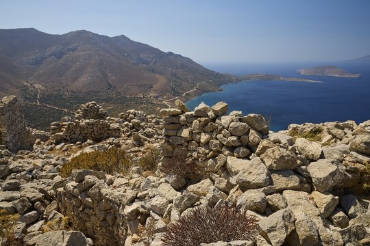Ruins overlooking the sea surrounded by hills and natural coastal scenery, Johanniter fortress from the 14th century AD, fortress of Megalo Chorio, Kastro, Megalo Chorio, Zero Waste Island, Tilos, Dodecanese, Greek Islands, Greece