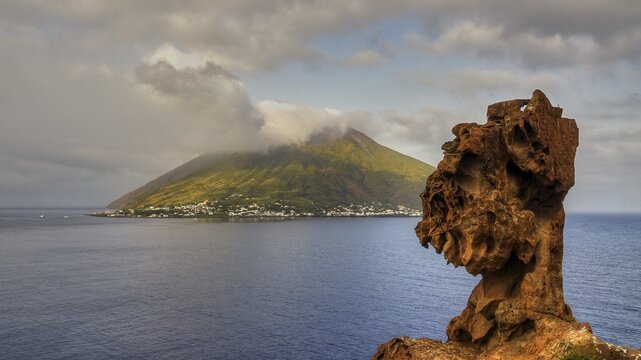 Grey-white clouds, Strombolichio, small volcanic rock island off Stromboli, view past bizarre lava rock, Stromboli, mountain, volcano, volcanic island, Stromboli, Aeolian Islands, Lipari Islands, Sicily, Italy