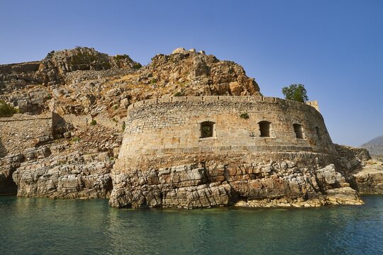 Ruins of an ancient fortress on a coastal rock formation with clear sky and sea, Venetian sea fortress, Leper Island, Spinalonga, Elounda Bay, Mirabello Bay, East Crete, Crete, Greek Islands, Greece