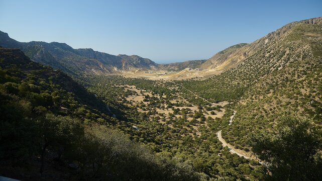 Wide valley with wooded slopes and mountains under a clear sky, volcanism, volcanic island, access to the crater, Nisyros, Dodecanese, Greek Islands, Greece