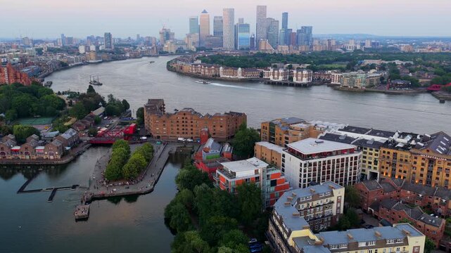 Aerial Video over London Docklands, Red Bridge, and Canary Wharf Skyline