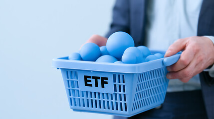 Fototapeta premium A businessman holds a blue shopping basket filled with blue spheres, representing investment diversification and market exchange trades
