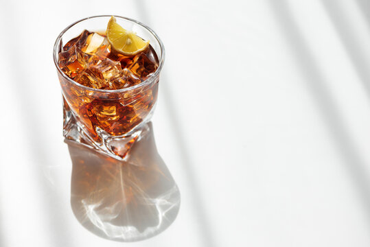 Refreshing iced coffee drink with lemon and ice