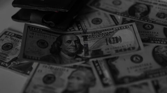 Police seized illegal money, smuggling. A close-up of the shadow market and dirty dollar bills used by criminals and scammers for laundering.