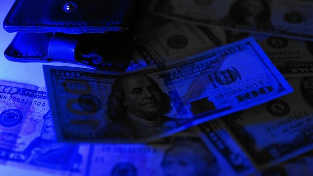 Police seized illegal money, smuggling. A close-up of the shadow market and dirty dollar bills used by criminals and scammers for laundering.