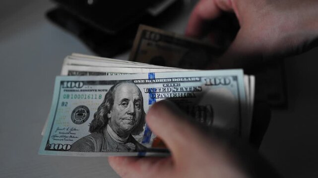 Police seized illegal money, smuggling. A close-up of the shadow market and dirty dollar bills used by criminals and scammers for laundering.