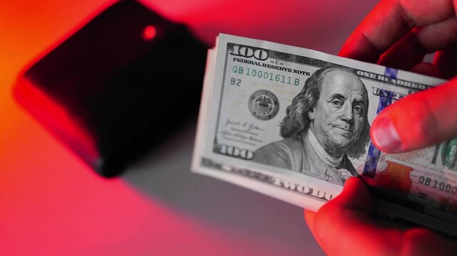 Police seized illegal money, smuggling. A close-up of the shadow market and dirty dollar bills used by criminals and scammers for laundering.
