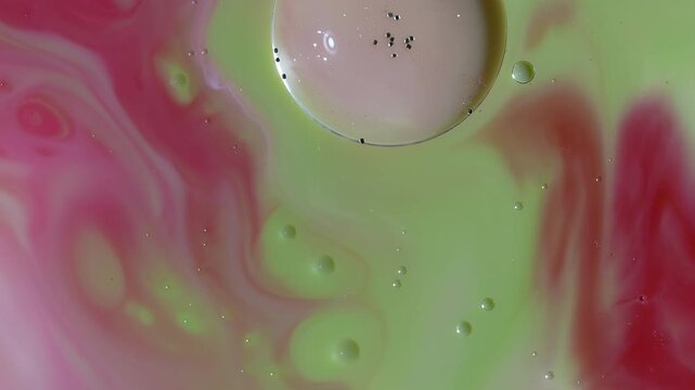Abstract Fluid Art Macro - Swirling Lime Green and Pink Paint with Glitter Sphere