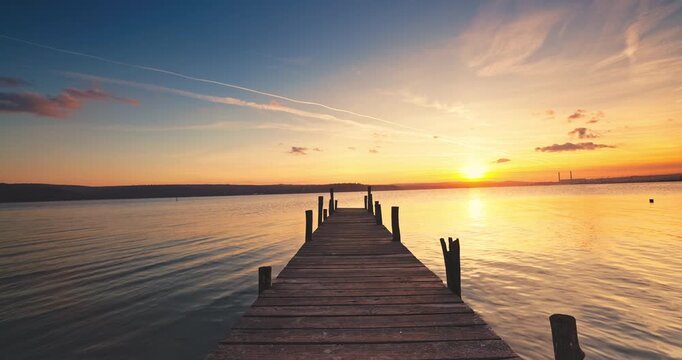 Wooden Dock on the lake during scenic sunset